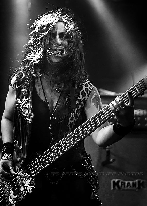Merry Adin in an intense black-and-white bass performance